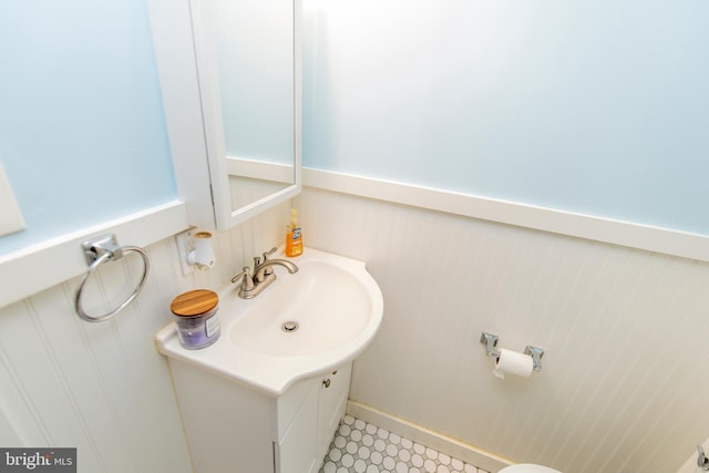 bathroom with wainscoting and vanity