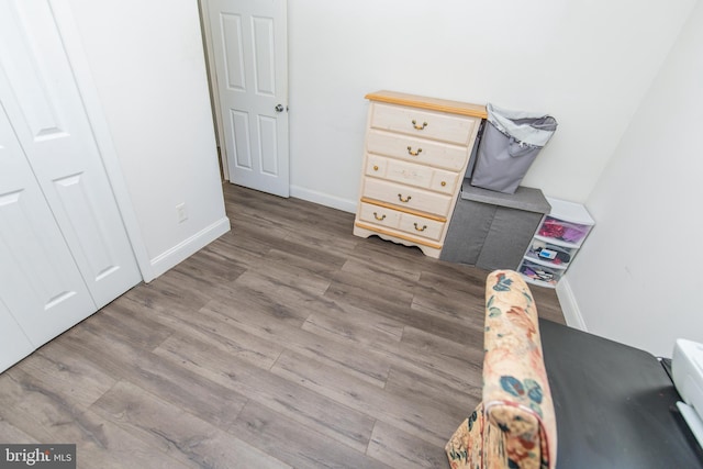 unfurnished bedroom featuring baseboards and wood finished floors