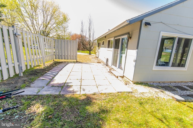 view of patio / terrace featuring fence