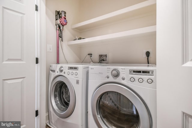 laundry area featuring washer and dryer and laundry area