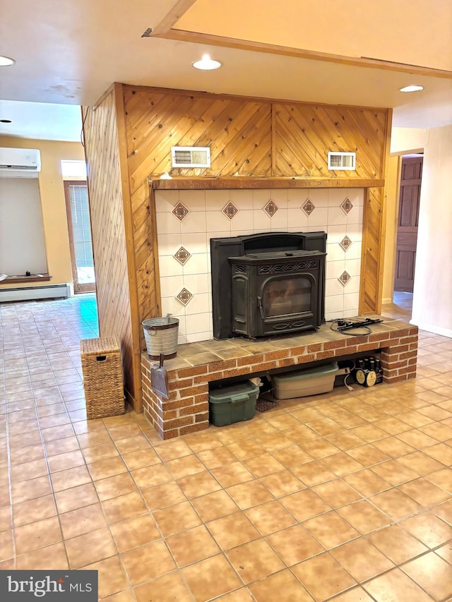 room details with wooden walls, a baseboard radiator, recessed lighting, a wall unit AC, and a wood stove