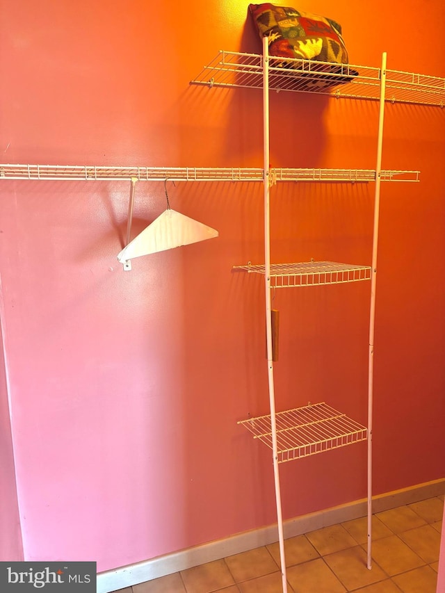 walk in closet featuring tile patterned flooring
