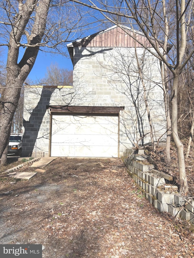 garage featuring driveway