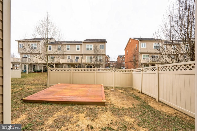 11351 Sandestin Pl, White Plains, MD 20695 - view of yard featuring a wooden deck, a residential view, and a fenced backyard