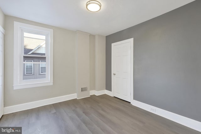 475-477 2nd St, Highspire, PA 17034 - empty room featuring visible vents, baseboards, and dark wood-style flooring