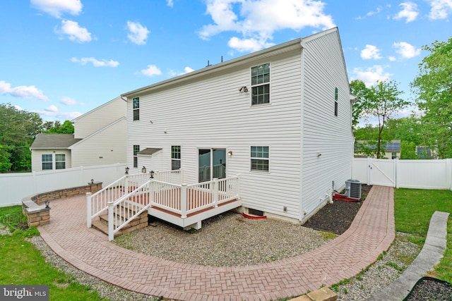 6984 Elm Ave, Elkridge, MD 21075 - rear view of property with a deck, cooling unit, a gate, and a fenced backyard
