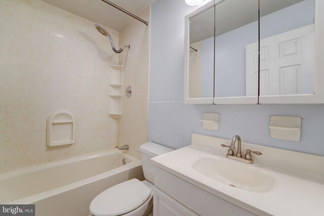 bathroom featuring tile walls, shower / bathtub combination, toilet, and vanity