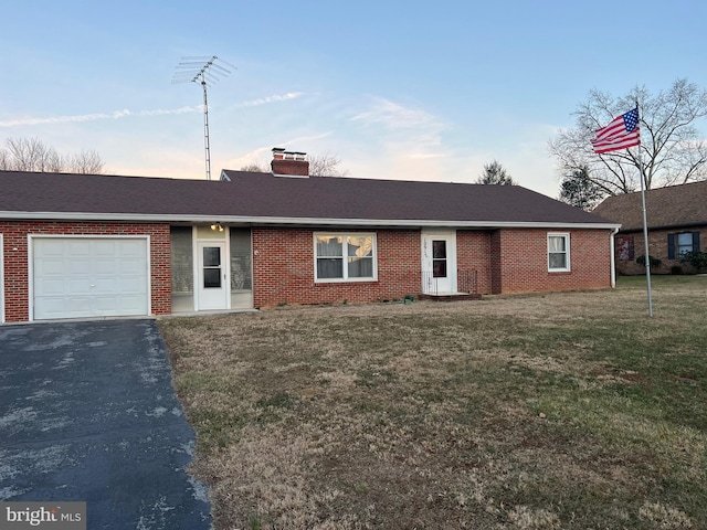10917 Kemper Dr, Williamsport, MD 21795 - ranch-style house with brick siding, a garage, a chimney, and a front yard