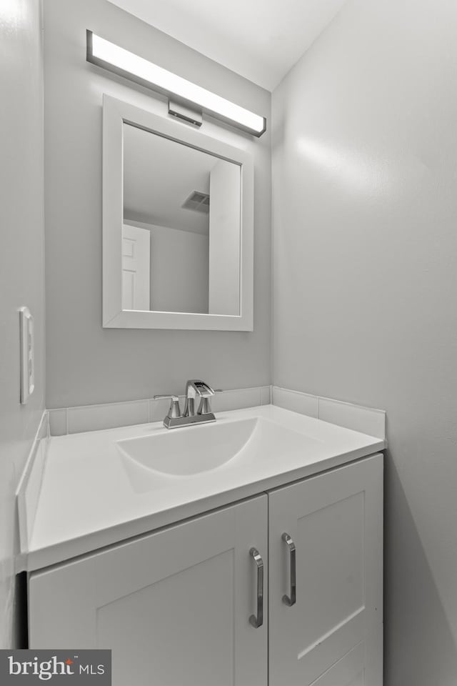 bathroom with visible vents and vanity