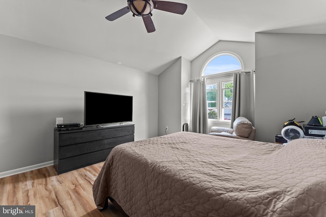 bedroom with lofted ceiling, ceiling fan, and wood finished floors
