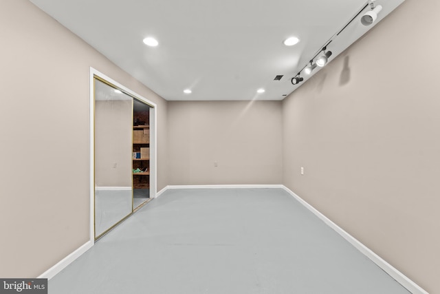 basement with baseboards and recessed lighting