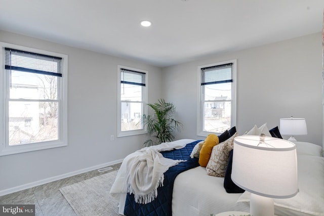 bedroom featuring visible vents and baseboards