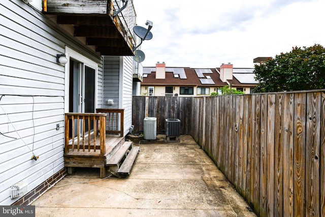 view of patio featuring central AC and a fenced backyard