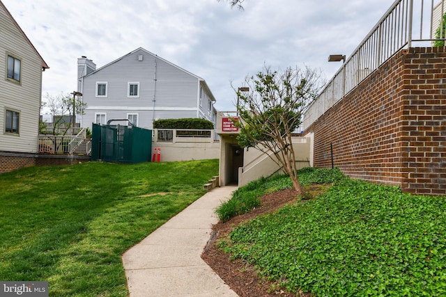 view of yard with fence and a gate
