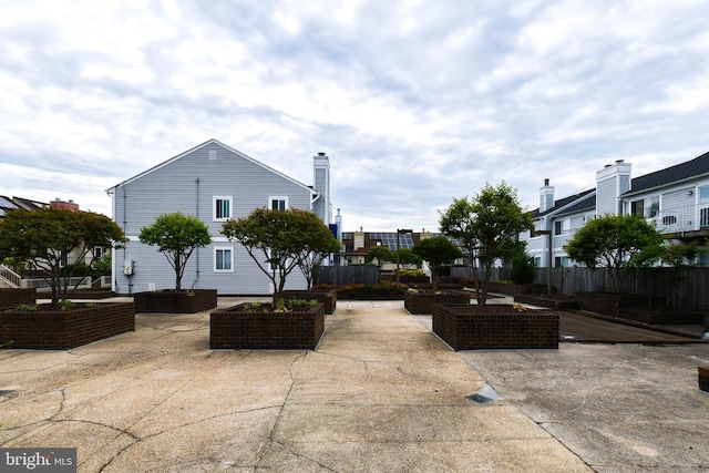 view of patio featuring fence
