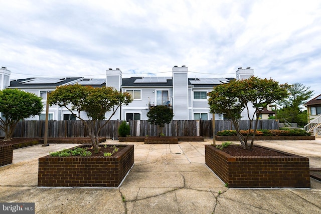 view of patio featuring fence