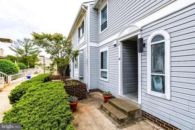 view of side of home with fence