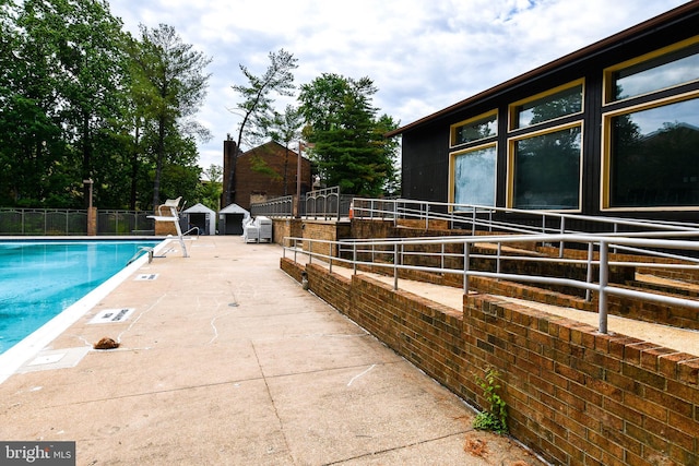 pool with an exterior structure and an outbuilding