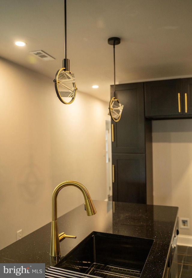2005 N Lawrence St, Philadelphia, PA 19122 - kitchen featuring a sink, recessed lighting, dark stone counters, and baseboards