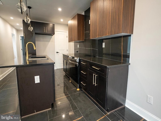 2005 N Lawrence St, Philadelphia, PA 19122 - kitchen featuring stainless steel electric stove, dark countertops, baseboards, a sink, and recessed lighting