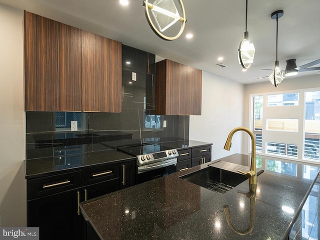 2005 N Lawrence St, Philadelphia, PA 19122 - kitchen featuring stainless steel range with electric cooktop, a sink, backsplash, modern cabinets, and recessed lighting