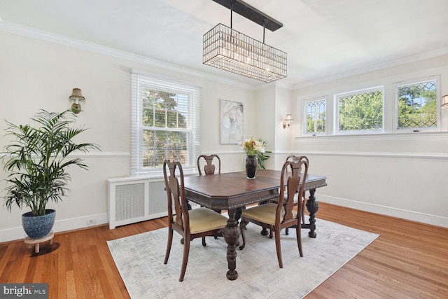 1614 Grace Church Rd, Silver Spring, MD 20910 - dining area with crown molding, wood finished floors, baseboards, a notable chandelier, and radiator