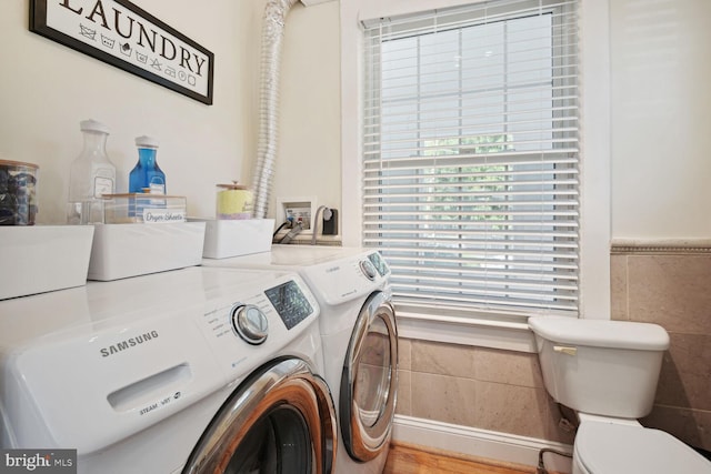 1614 Grace Church Rd, Silver Spring, MD 20910 - washroom featuring laundry area, independent washer and dryer, and tile walls