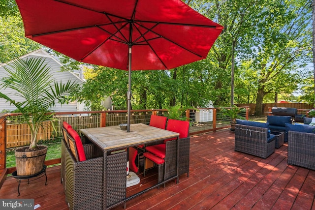 1614 Grace Church Rd, Silver Spring, MD 20910 - wooden deck featuring an outdoor hangout area, outdoor dining area, and a fenced backyard