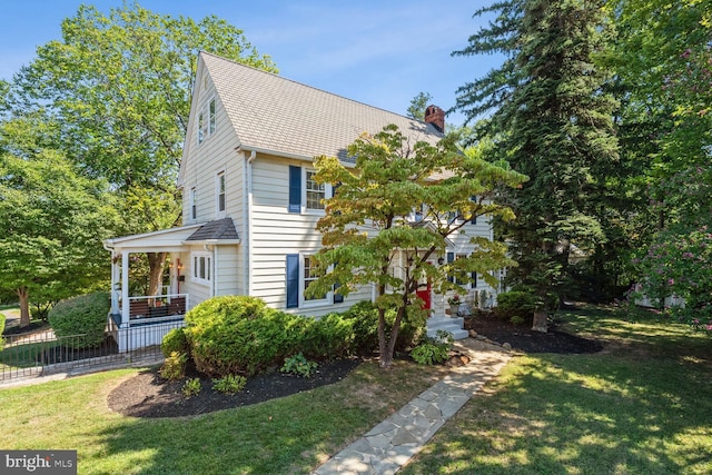 1614 Grace Church Rd, Silver Spring, MD 20910 - view of front of property with roof with shingles, fence, a chimney, and a front yard
