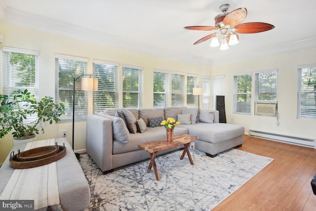 1614 Grace Church Rd, Silver Spring, MD 20910 - sunroom with crown molding, wood finished floors, baseboard heating, and a deck