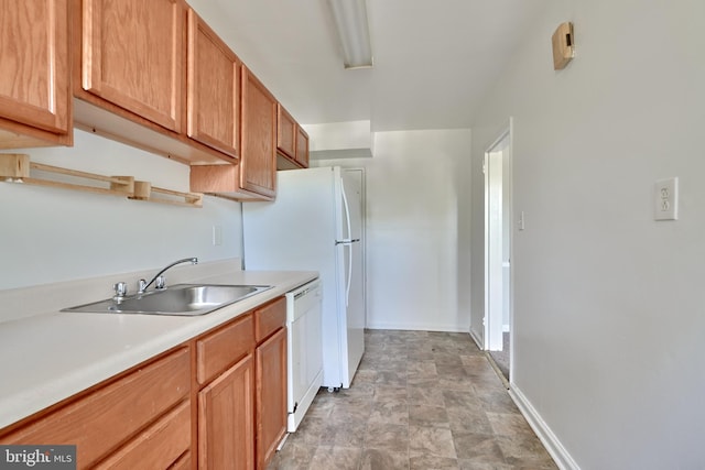 4707 Wrenwood Ave, Baltimore, MD 21212 - kitchen featuring baseboards, white dishwasher, a sink, light countertops, and stone finish flooring