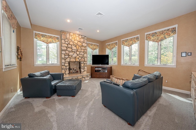 carpeted living room featuring recessed lighting, a fireplace, visible vents, and baseboards