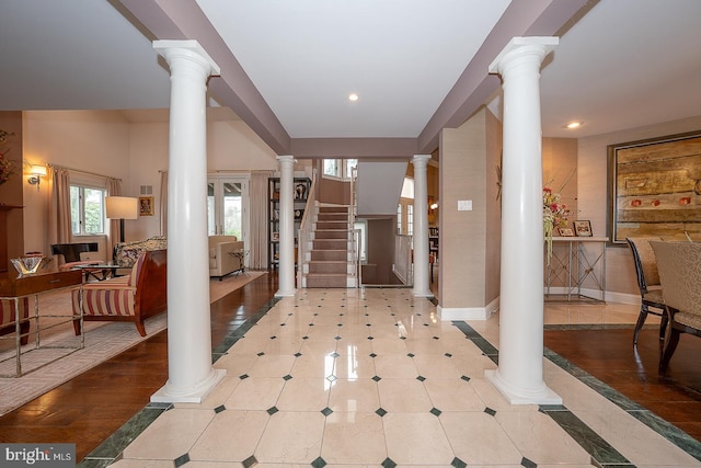 entryway with recessed lighting, stairway, ornate columns, and baseboards