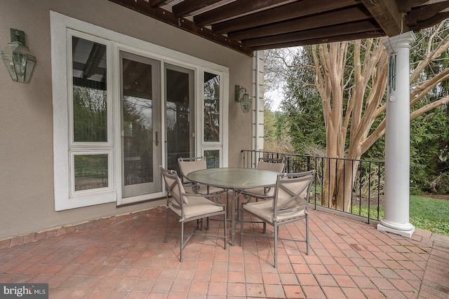 view of patio featuring outdoor dining area