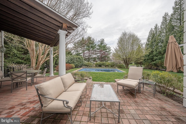 view of patio / terrace featuring outdoor dining space, an outdoor living space, and an outdoor pool