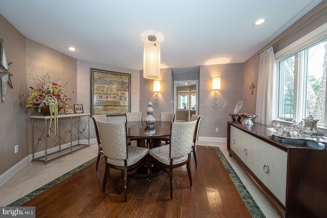 dining area featuring recessed lighting, baseboards, and wood finished floors