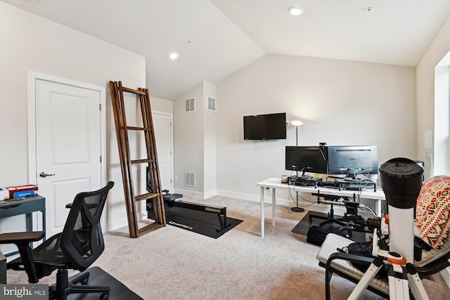 home office with carpet flooring, visible vents, baseboards, and vaulted ceiling