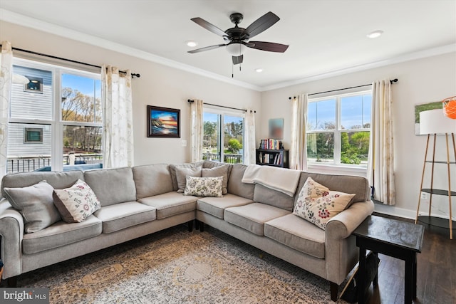 living area featuring dark wood-style flooring, ornamental molding, ceiling fan, and recessed lighting