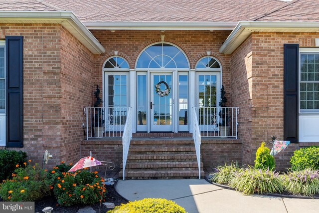 180 Featherbed Ln, Pilesgrove, NJ 08098 - doorway to property with brick siding and a shingled roof