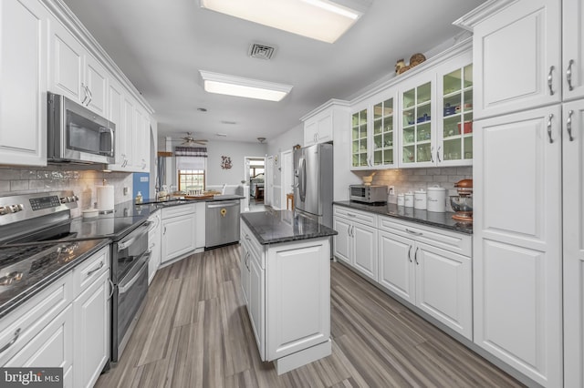180 Featherbed Ln, Pilesgrove, NJ 08098 - kitchen with glass insert cabinets, appliances with stainless steel finishes, decorative backsplash, and white cabinetry