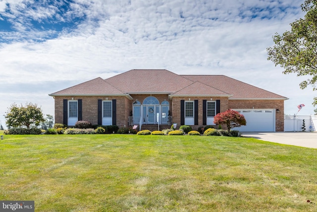 180 Featherbed Ln, Pilesgrove, NJ 08098 - view of front of property with concrete driveway, brick siding, an attached garage, and a front lawn