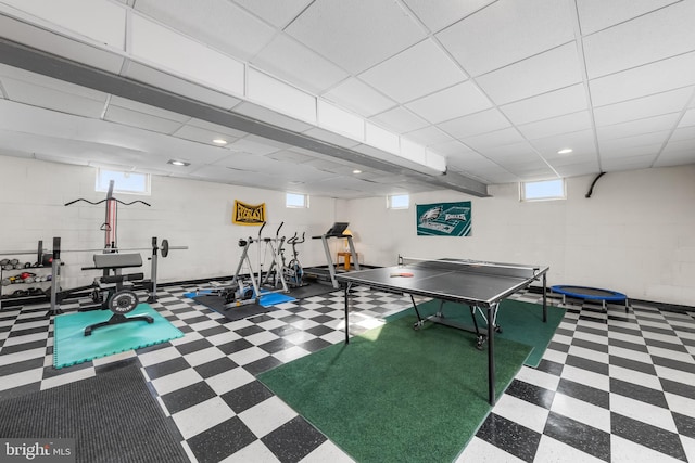 180 Featherbed Ln, Pilesgrove, NJ 08098 - rec room featuring concrete block wall, tile patterned floors, and plenty of natural light