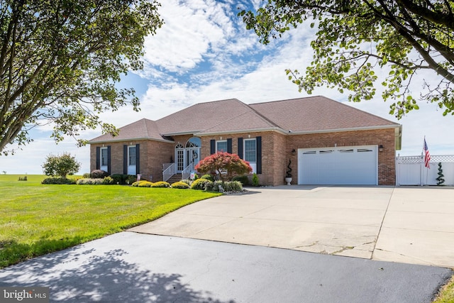 180 Featherbed Ln, Pilesgrove, NJ 08098 - ranch-style home featuring a garage, a front lawn, roof with shingles, brick siding, and concrete driveway