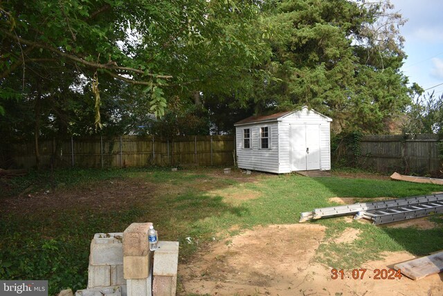 31 Riverview Ave, Chesapeake City, MD 21915 - view of yard featuring a storage unit and an outbuilding