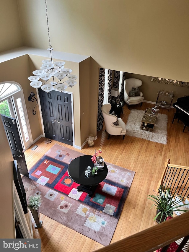 1388 Old Barn Cir, Downingtown, PA 19335 - entryway with wood-type flooring, a chandelier, and baseboards