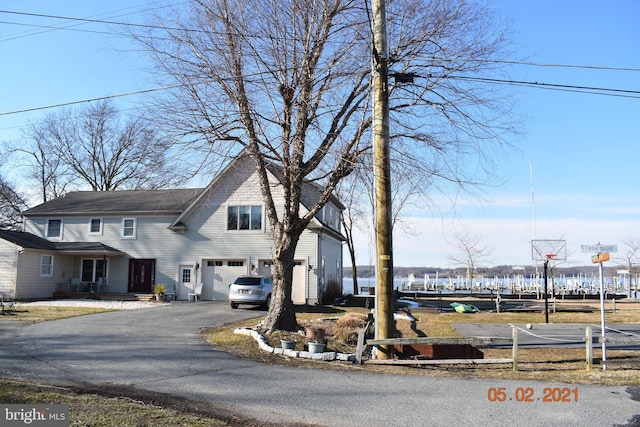 view of front of property with driveway and a garage