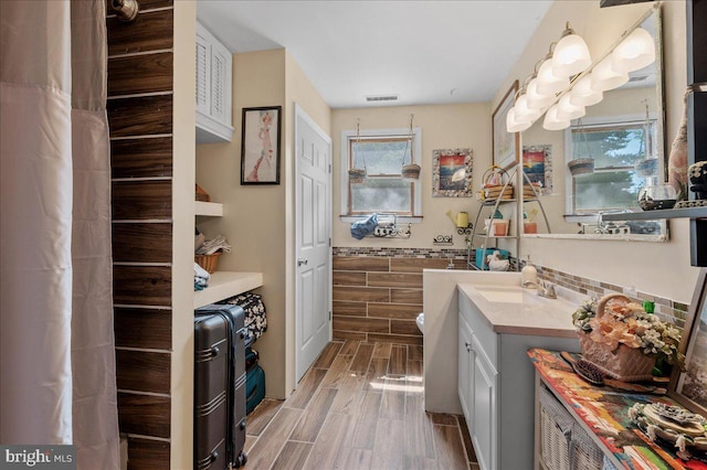 280 Hollywood Beach Rd, Chesapeake City, MD 21915 - full bath featuring vanity, healthy amount of natural light, and wood finish floors