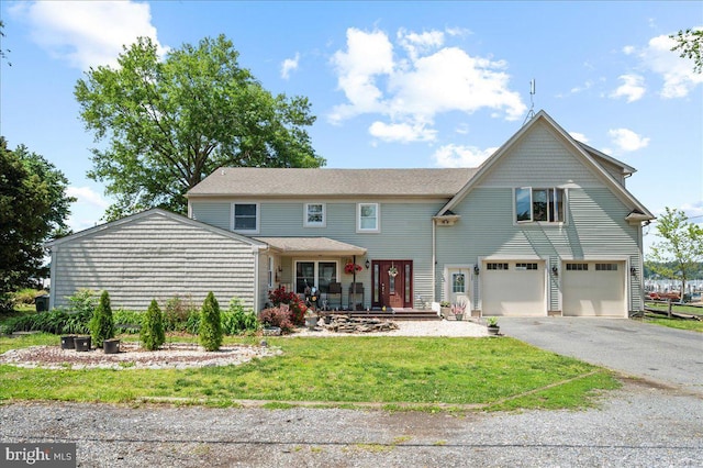 280 Hollywood Beach Rd, Chesapeake City, MD 21915 - view of front of property featuring an attached garage, driveway, a front yard, and covered porch