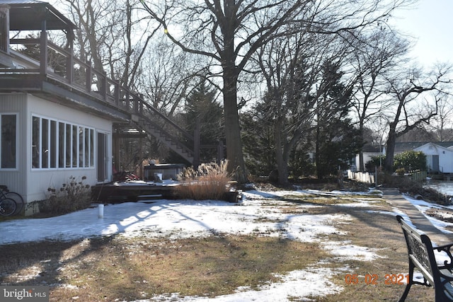 yard layered in snow with stairs
