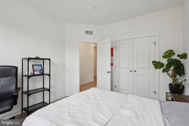 4902 Longmire Way Unit 24, Chantilly, VA 20151 - bedroom featuring wood finished floors, a closet, and baseboards